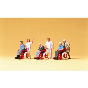 Rollstuhlfahrer mit Begleitpersonen