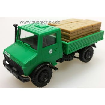 Unimog U 1300 Pritsche beladen mit Paletten und Sandsäcken 