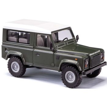 Land Rover Defender 90, grün mit weißem Dach, Baujahr 1983