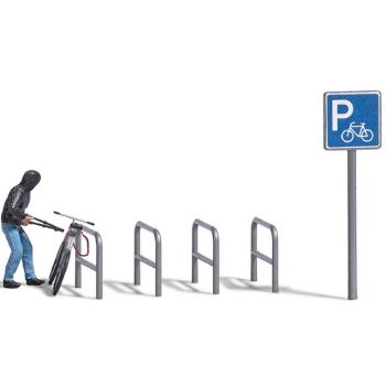 Fahrradklau - Fahrraddieb samt Werkzeug, Fahrrad und Pahrradparkplatz, mit Schild und Anlehngittern